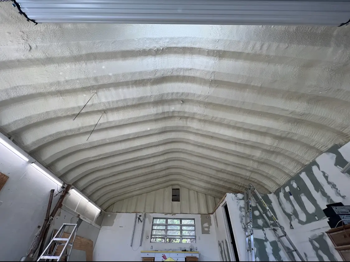 Spray polyurethane foam applied to the underside of a metal roof deck in South Bay